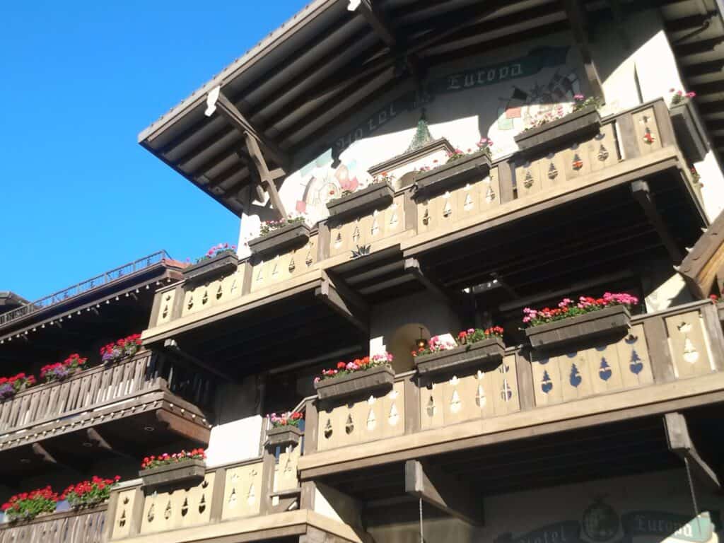 The Hotel Europa in Leavenworth Washington displays the German charm of this town with colorful flower boxes, carved wooden balconies, and flags painted on its facade.