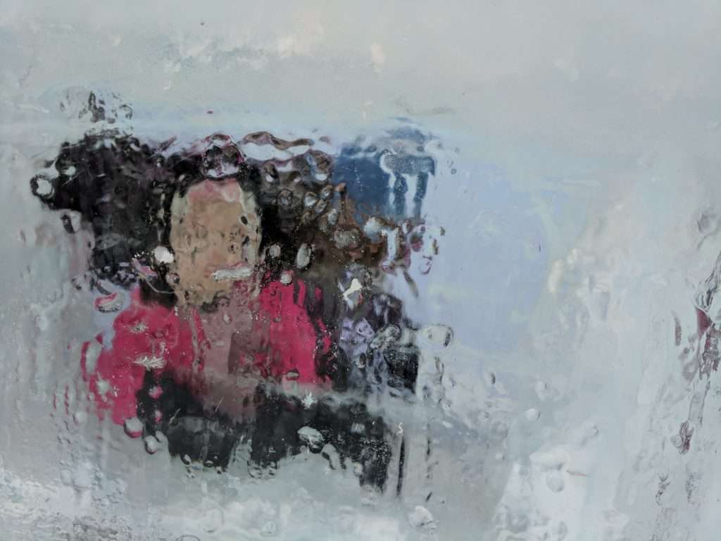 K & Michele behind an ice window