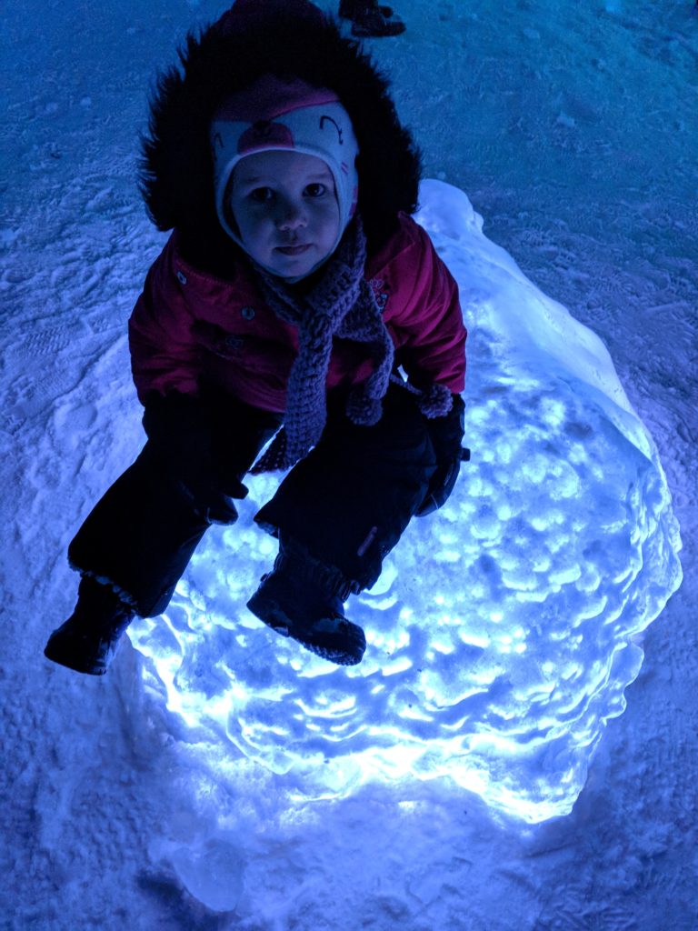 K sitting on an illuminated ball of ice