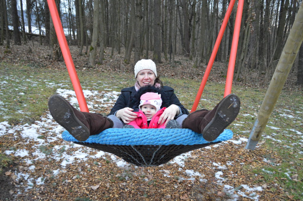 Playground swing in Germany with kids