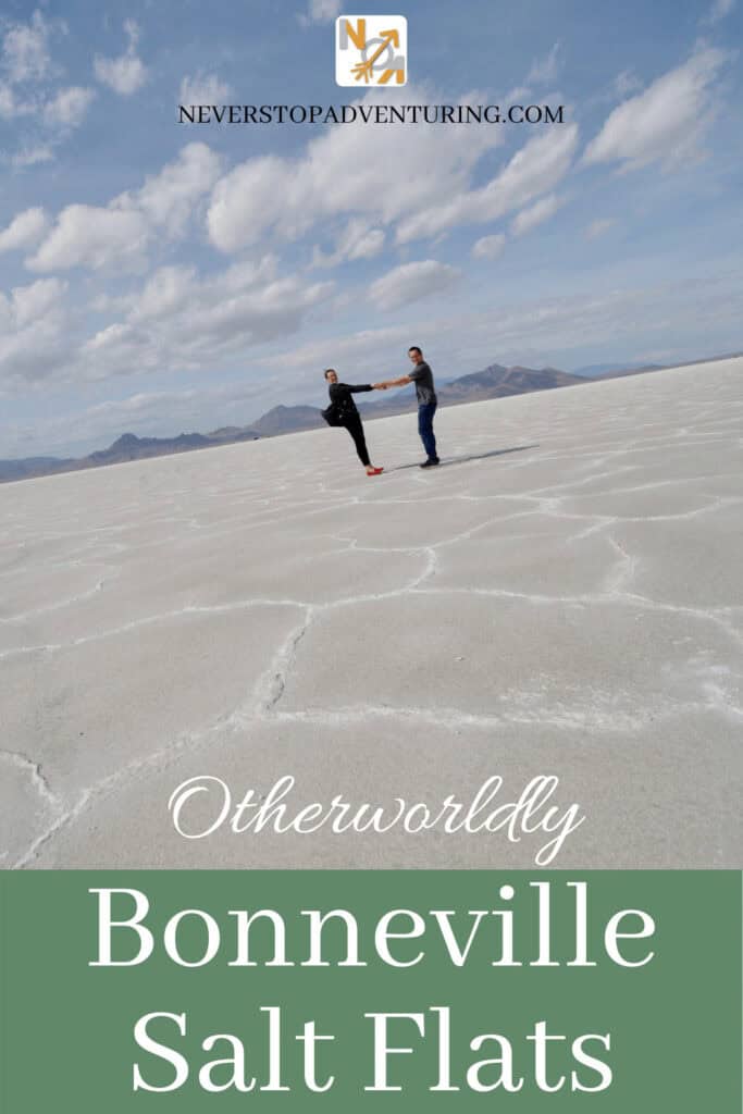 Pinnable image of a couple holding hands and leaning back standing on the Bonneville Salt Flats in Utah