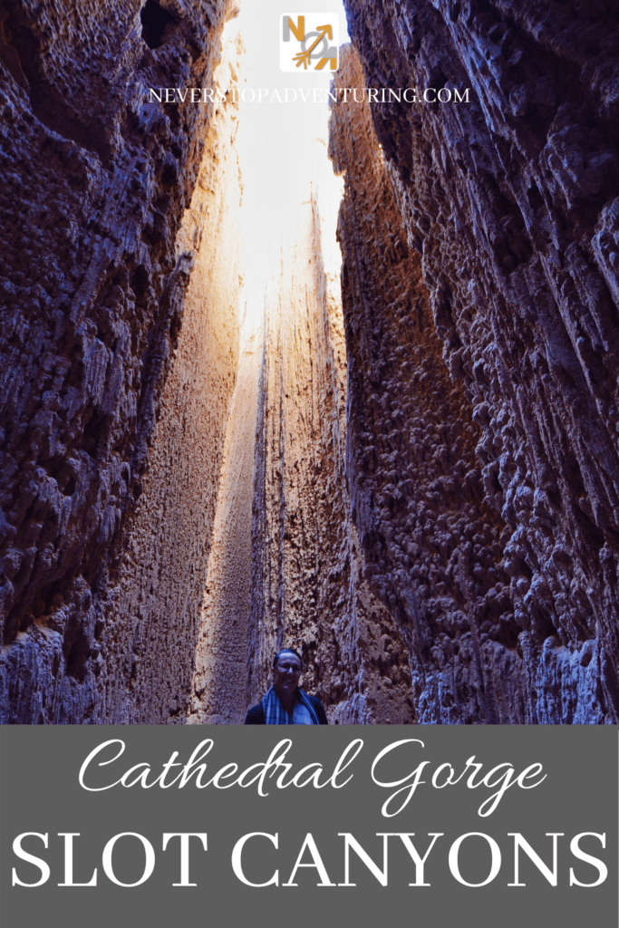 A pinnable image of a woman standing in a slot canyon at Cathedral Gorge