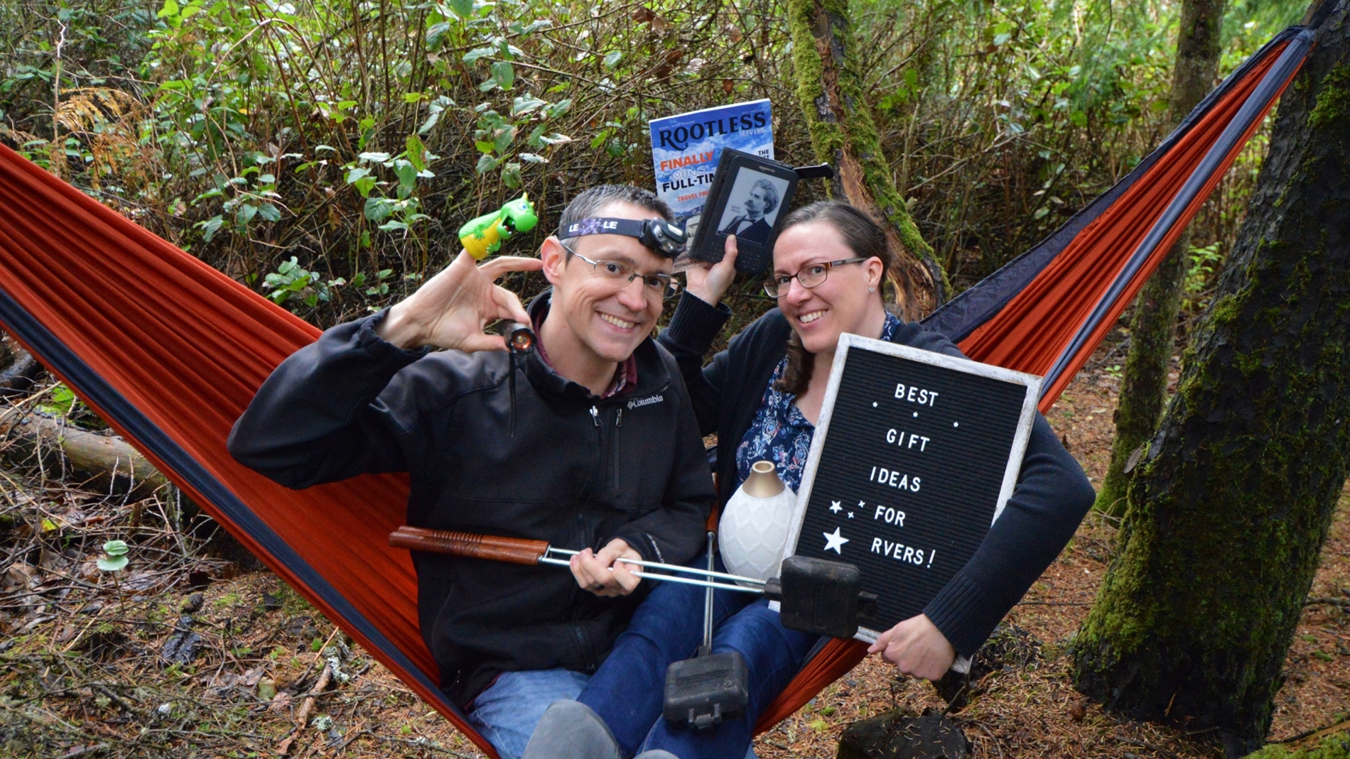 Couple sitting in hammock holding best RV gifts