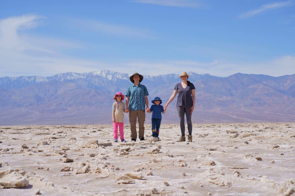 Family out on Death Valley National Park Badwater Basin salt flat