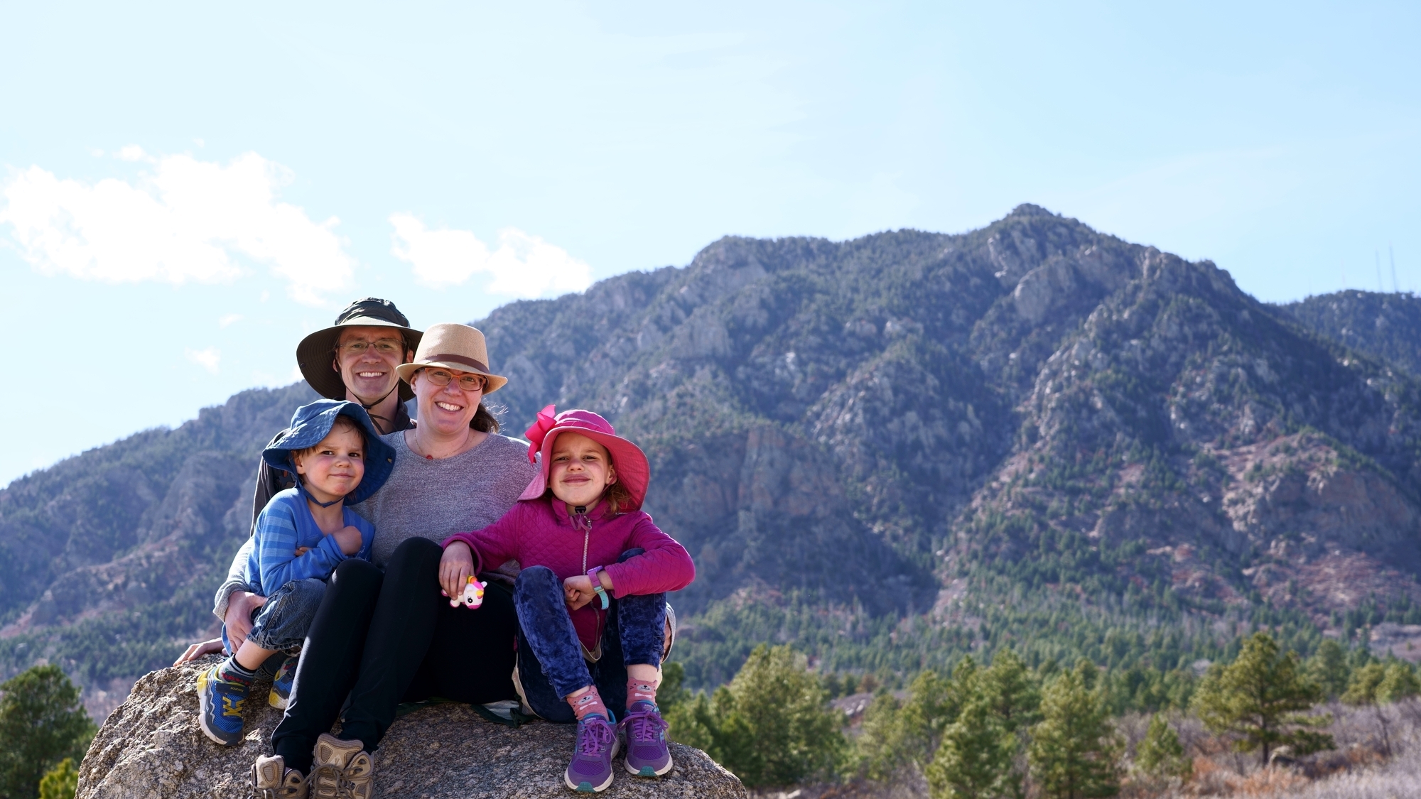 Family in front of Cheyenne Mountain