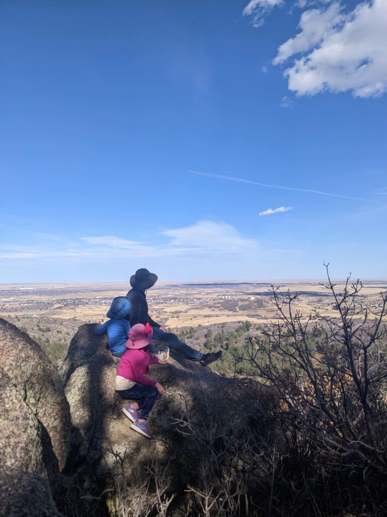 Family looking over Colorado Springs from a hiking trail