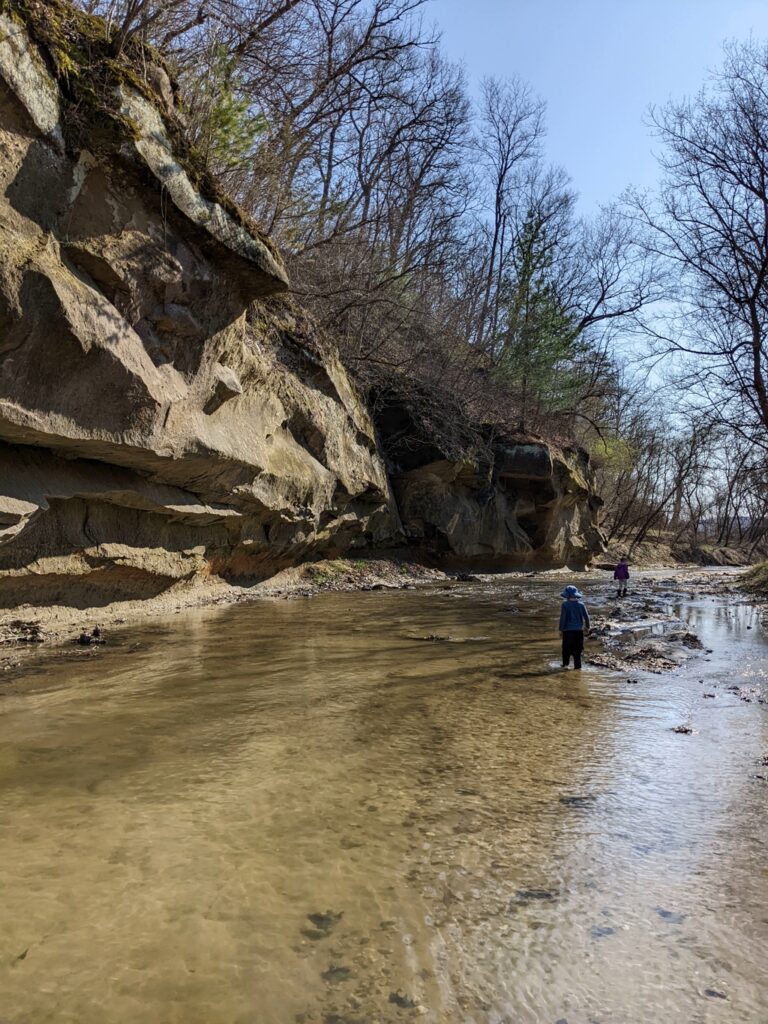 Kids walking in the creek