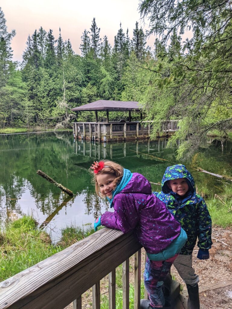 Kids at Palms Book State Park with spring behind